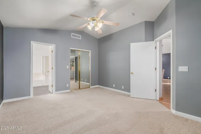 a view of a livingroom with a chandelier fan