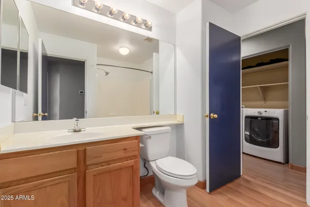 a bathroom with a sink a toilet and vanity