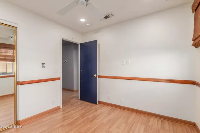 an empty room with wooden floor