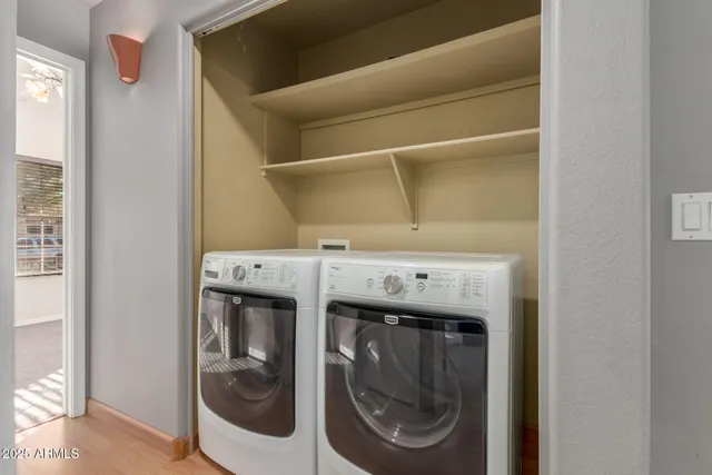 a utility room with washing machine