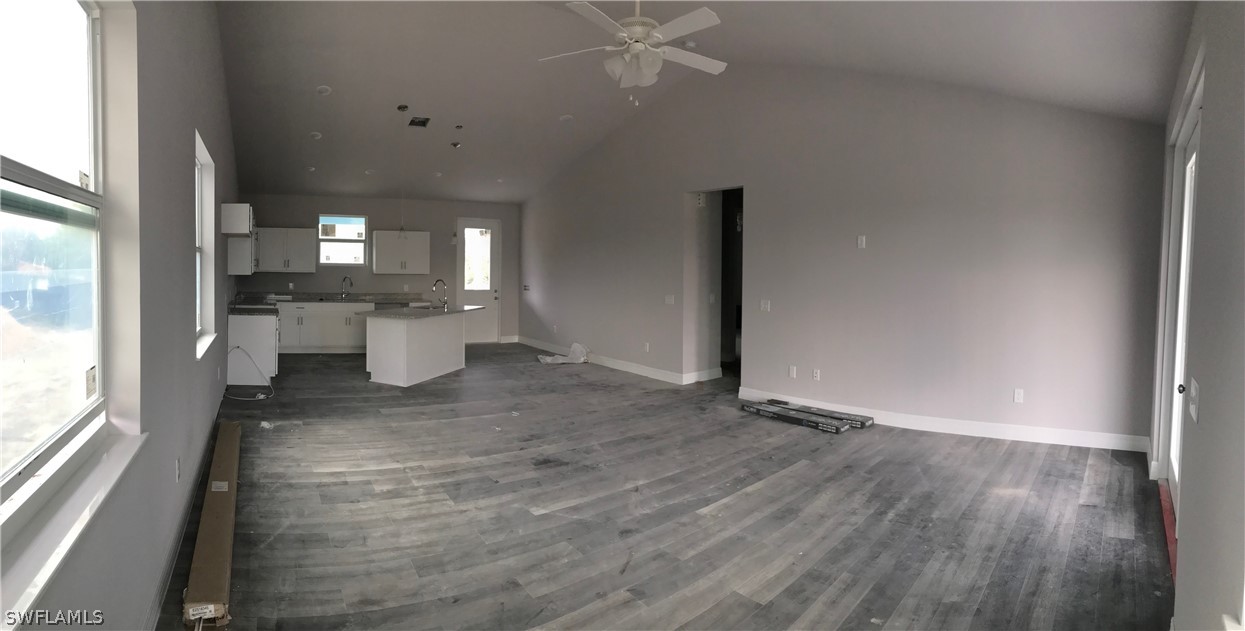 6014 Stratton Road Fort Myers, FL 33905 - Photo 6 of 14 wooden floor in an empty room with a window