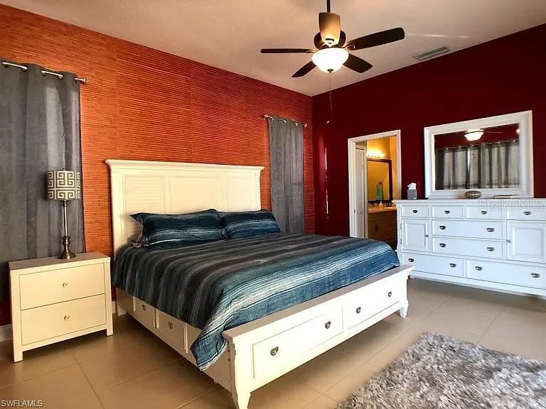 1647 Riverside Drive Daytona Beach, FL 32117 - Photo 18 of 29 a spacious bedroom with a bed and a dresser