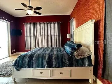 a bedroom with a bed and window