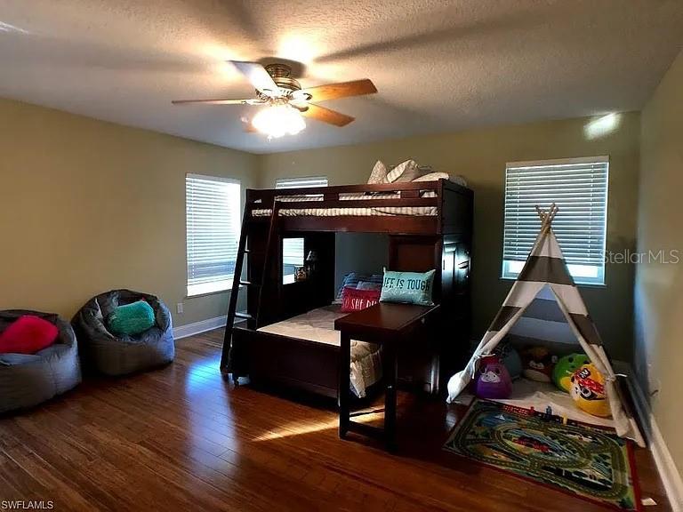 1647 Riverside Drive Daytona Beach, FL 32117 - Photo 21 of 29 a living room with furniture and a chandelier