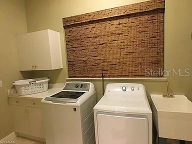 1647 Riverside Drive Daytona Beach, FL 32117 - Photo 29 of 29 a utility room with dryer and washer