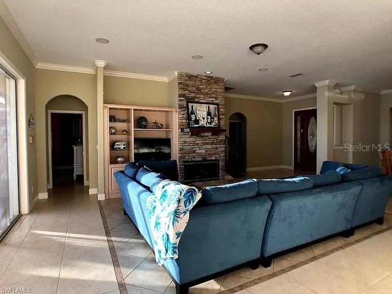 1647 Riverside Drive Daytona Beach, FL 32117 - Photo 8 of 29 a living room with fireplace furniture and a rug