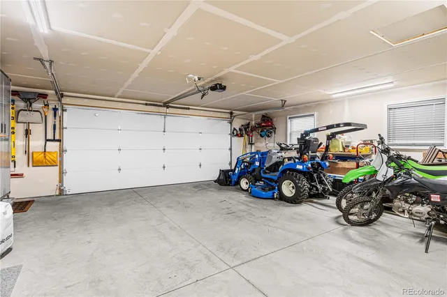 a view of a garage with parked cars