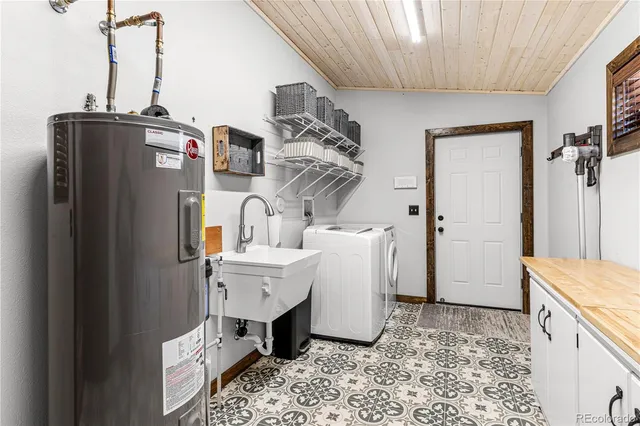 a room with refrigerator and cabinets