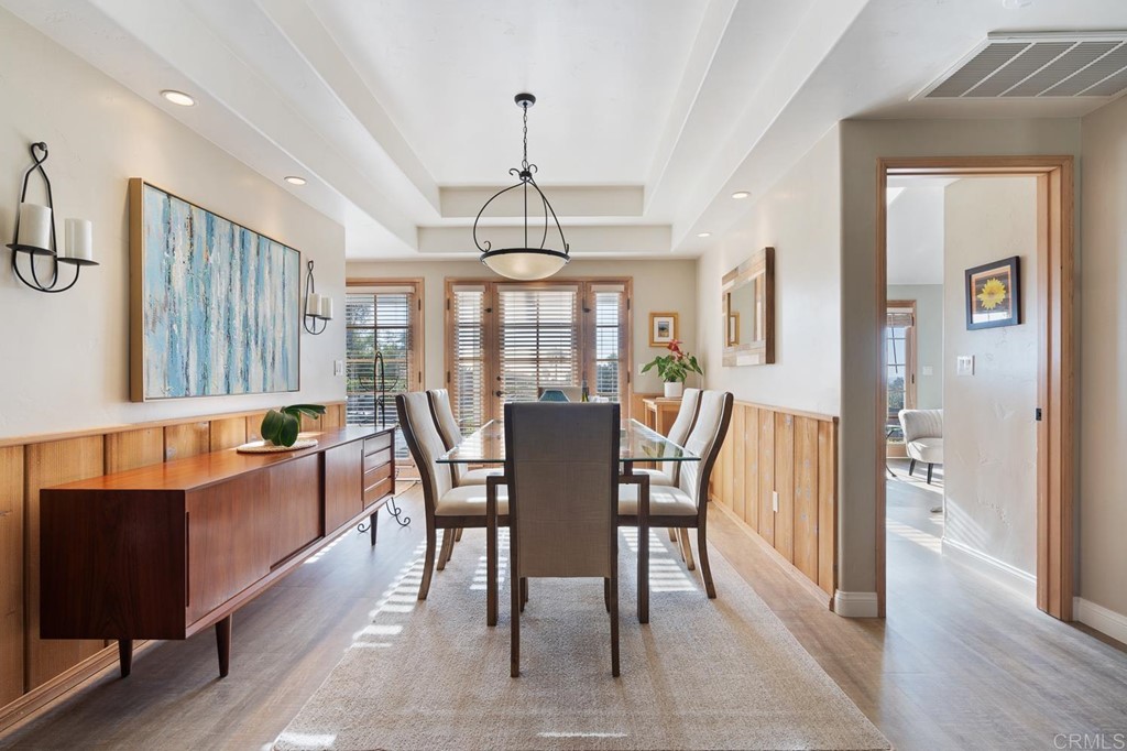 1754 Crest Drive Encinitas, CA 92024 - Photo 11 of 43 a view of a dining room with furniture window and wooden floor