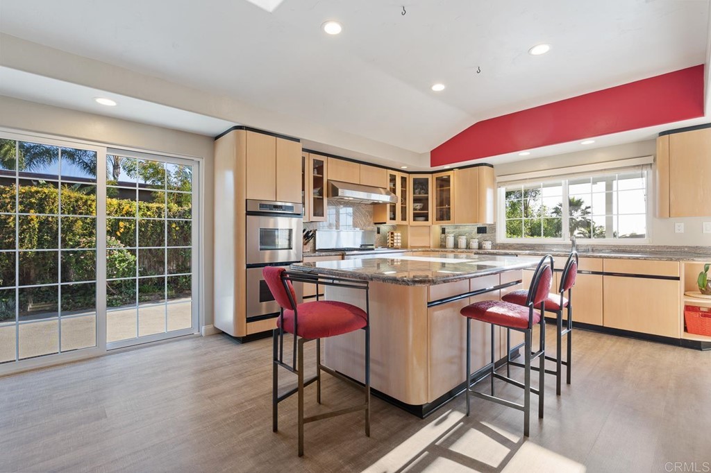 1754 Crest Drive Encinitas, CA 92024 - Photo 12 of 43 a dining hall with stainless steel appliances granite countertop a dining table chairs and a large window