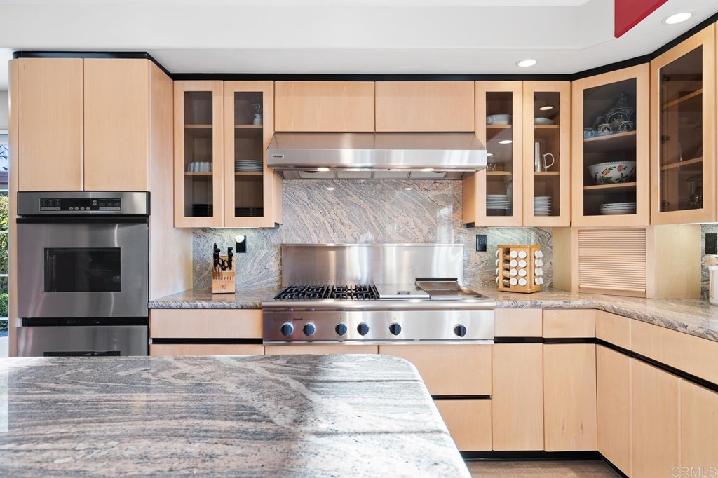 1754 Crest Drive Encinitas, CA 92024 - Photo 15 of 43 a kitchen with stainless steel appliances granite countertop a stove and a sink