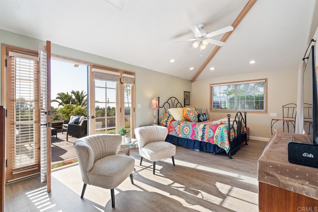 1754 Crest Drive Encinitas, CA 92024 - Photo 17 of 43 a bedroom with a bed and large windows