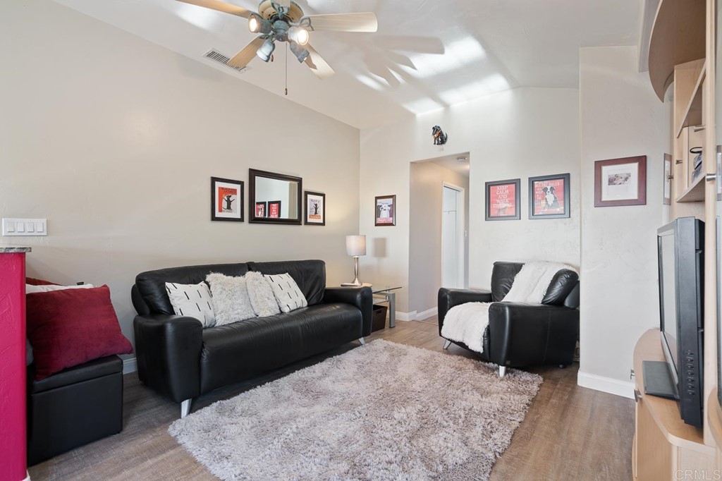1754 Crest Drive Encinitas, CA 92024 - Photo 25 of 43 a living room with furniture and a flat screen tv