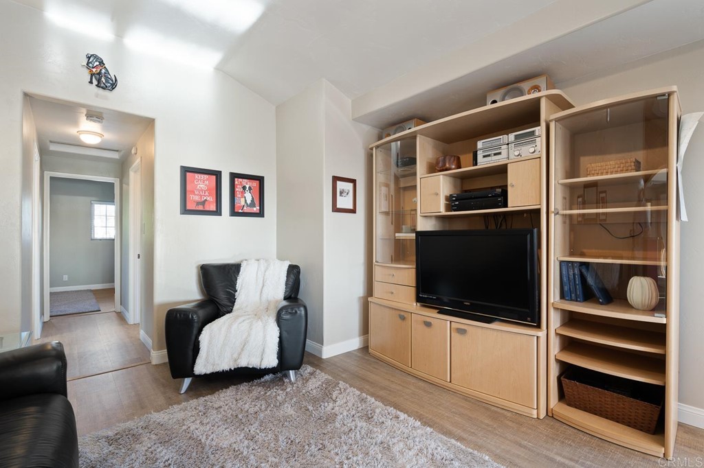1754 Crest Drive Encinitas, CA 92024 - Photo 26 of 43 a living room with furniture and a flat screen tv