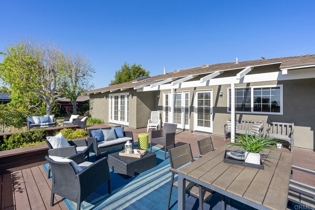 1754 Crest Drive Encinitas, CA 92024 - Photo 28 of 43 a view of a house with a patio and a dining space with furniture