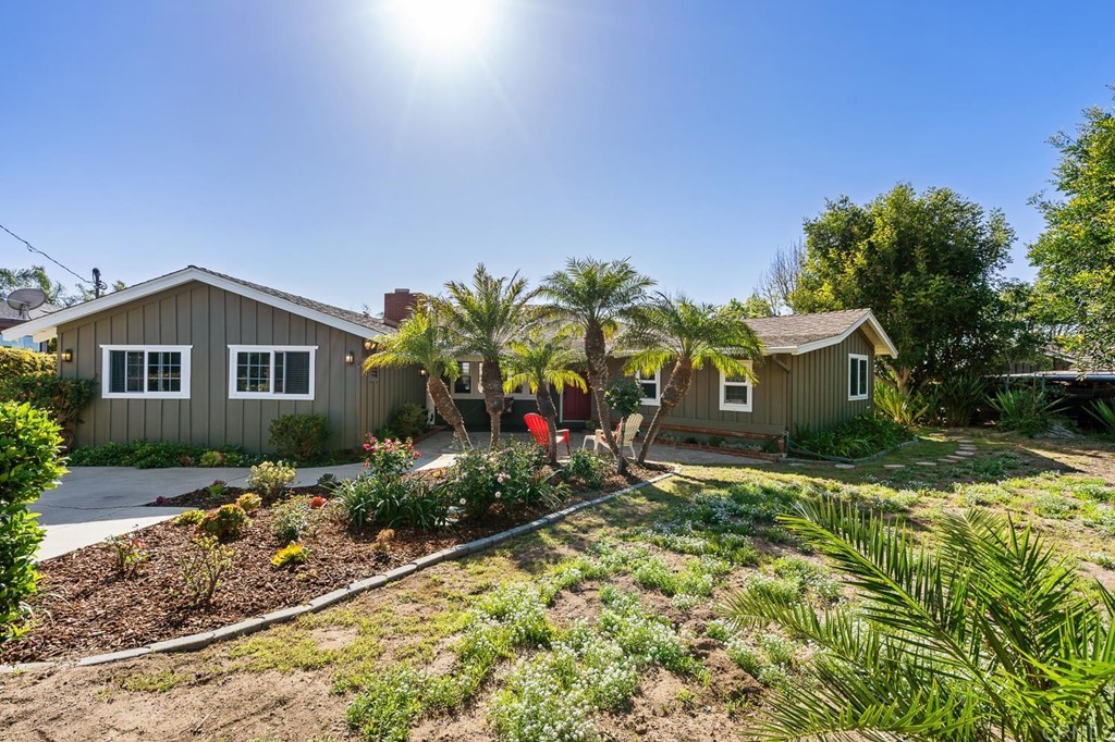 1754 Crest Drive Encinitas, CA 92024 - Photo 6 of 43 a front view of a house with garden