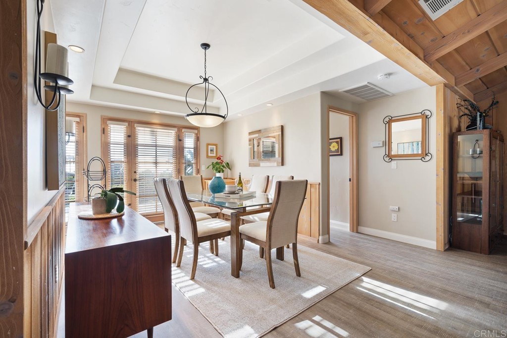 1754 Crest Drive Encinitas, CA 92024 - Photo 10 of 43 a view of a dining room with furniture window and wooden floor
