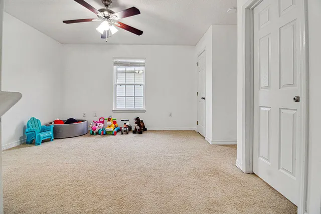 a play room with toys and a window