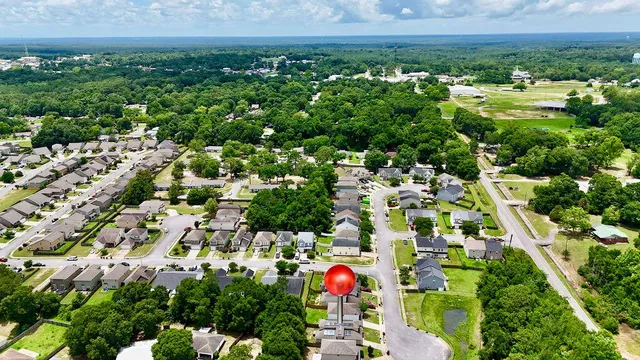 a kitchen with stainless steel appliances granite countertop a stove refrigerator and microwave