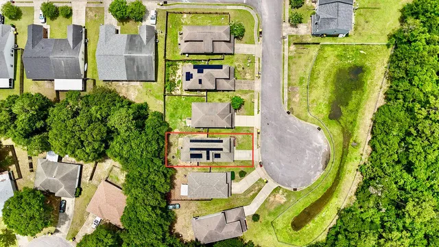 a kitchen with stainless steel appliances granite countertop a refrigerator a stove a sink a microwave oven with a dining table and chairs