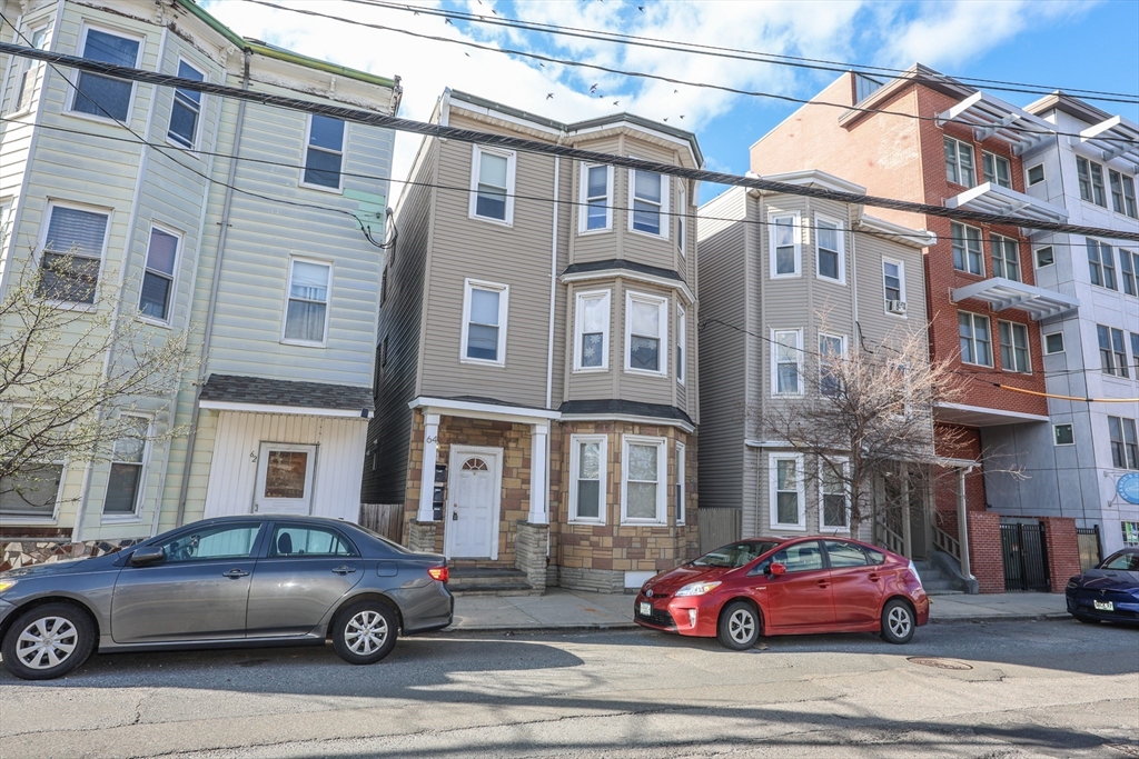 64 Bremen Street, Unit 3 Boston, MA 02128 - Photo 1 of 16 a cars parked in front of a building