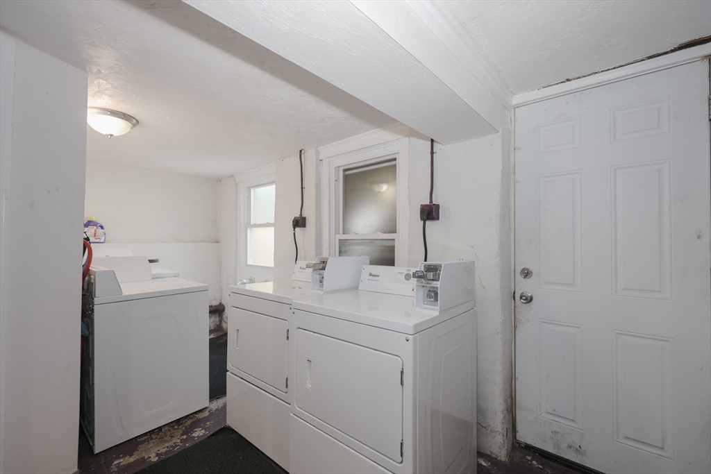 64 Bremen Street, Unit 3 Boston, MA 02128 - Photo 14 of 16 a bathroom with a sink a light fixture a vanity and a mirror