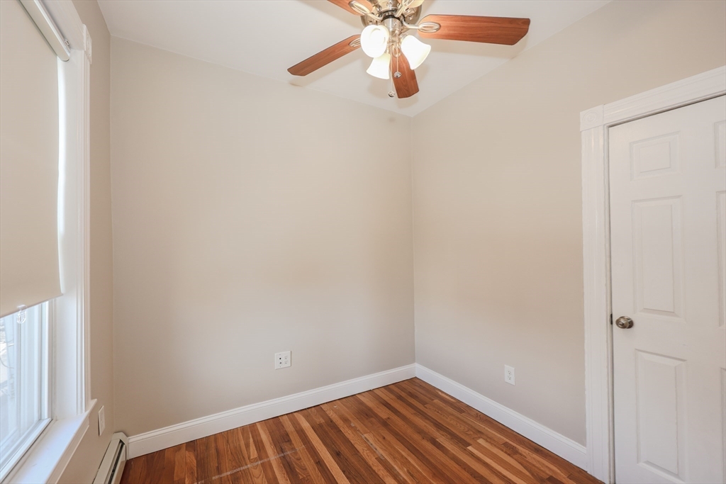 64 Bremen Street, Unit 3 Boston, MA 02128 - Photo 7 of 16 a view of a room with wooden floor and fan