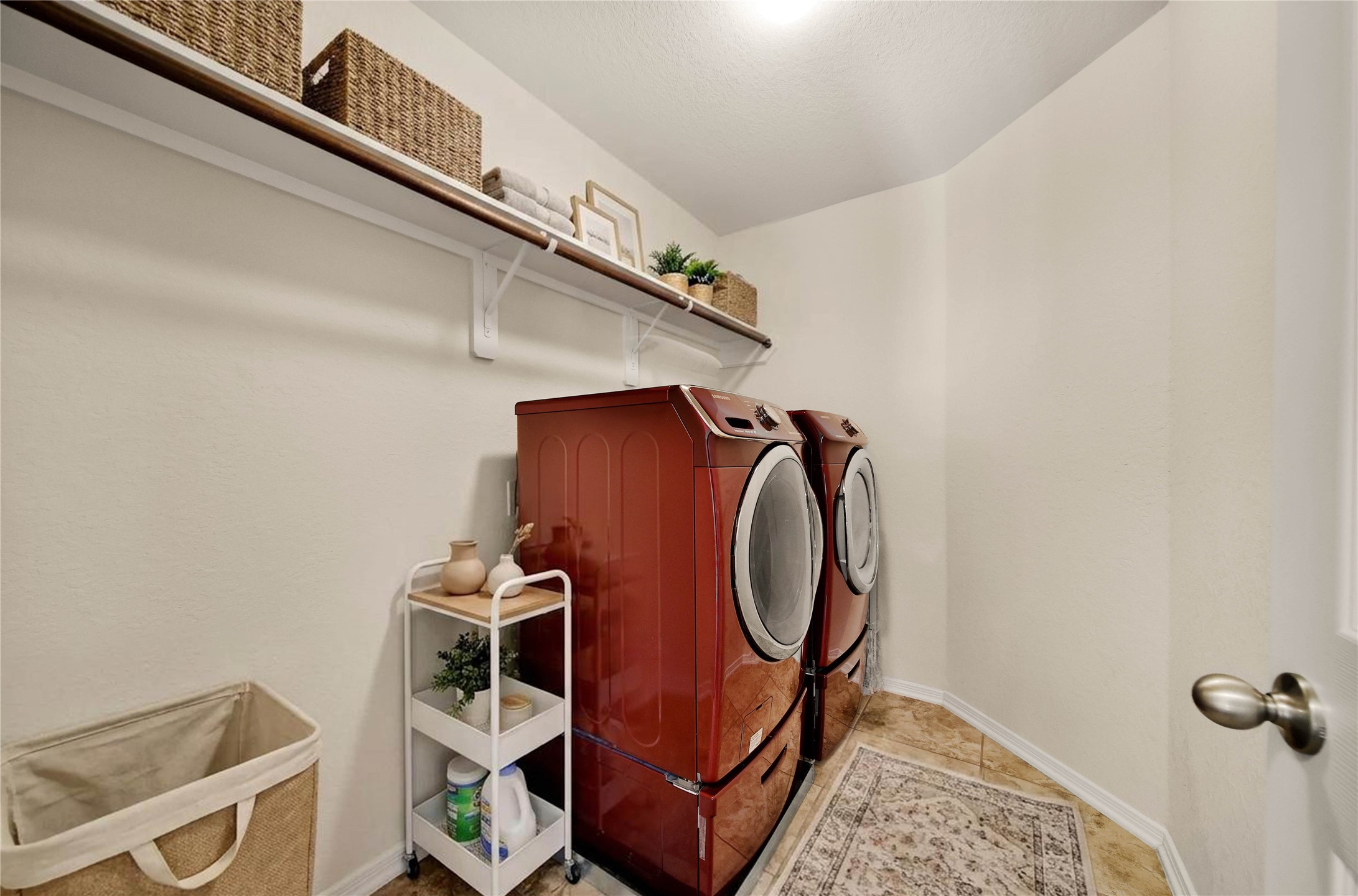 2672 Magnolia Fair Way Spring, TX 77386 - Photo 26 of 49 The laundry room is conveniently located between the main bedrooms with plenty of space for additional storage. The PEX plumbing hub is behind the door.
