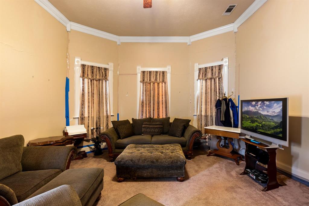404 East Main Street Ladonia, TX 75449 - Photo 11 of 27 a living room with furniture and a flat screen tv