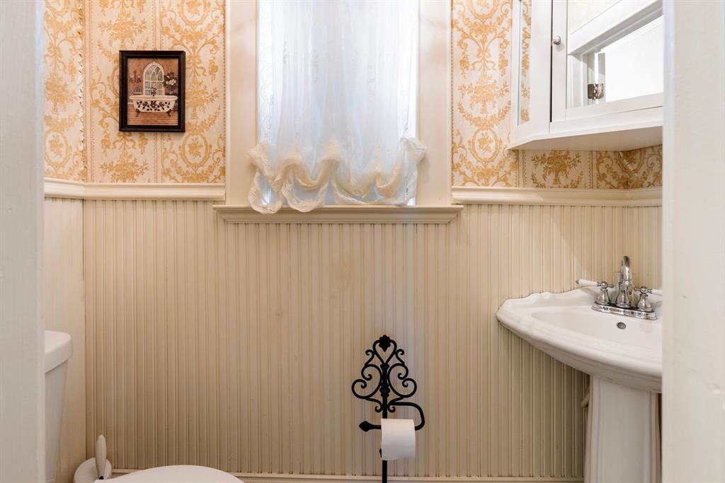 404 East Main Street Ladonia, TX 75449 - Photo 14 of 27 a bathroom with a sink and a mirror