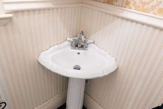 a bed room with a bed and a chandelier