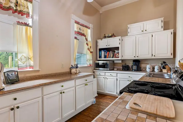 a kitchen with a stove and cabinets