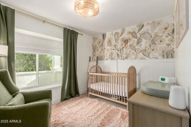 a bedroom with furniture and a window