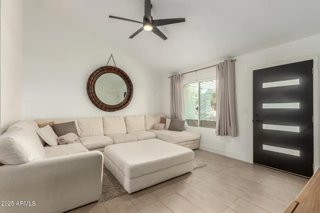 a living room with a couch and a window