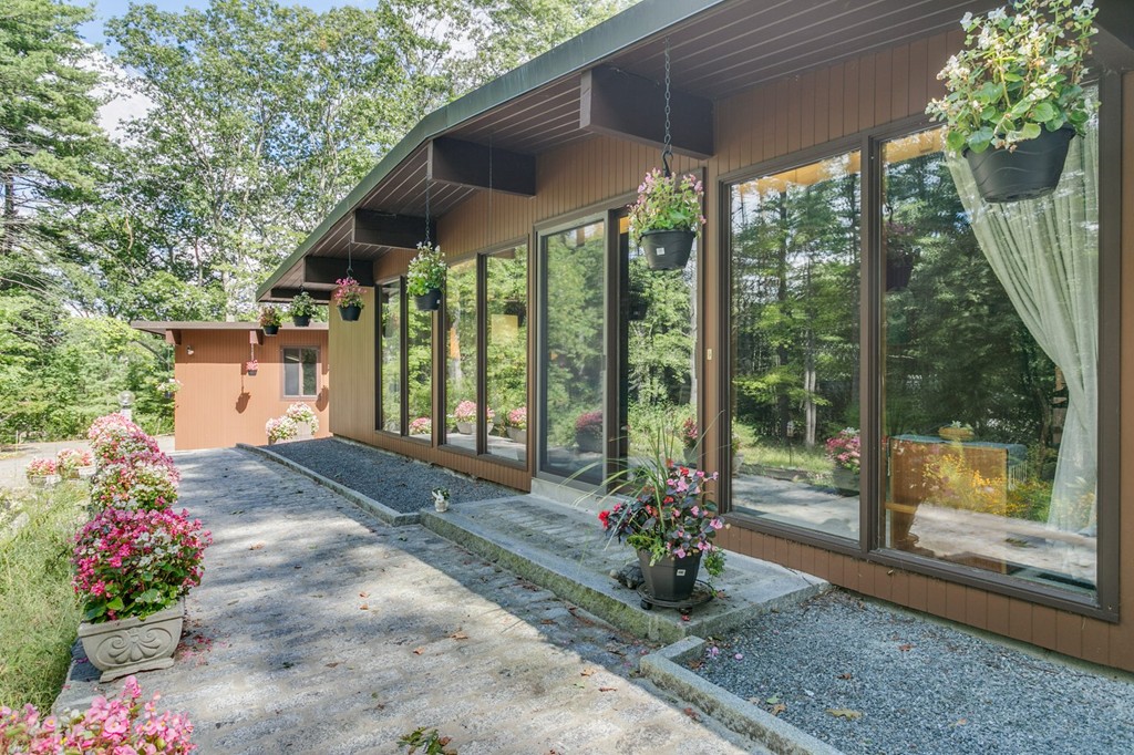 27 Conant Road Lincoln, MA 01773 - Photo 1 of 16 a garden view with a seating space