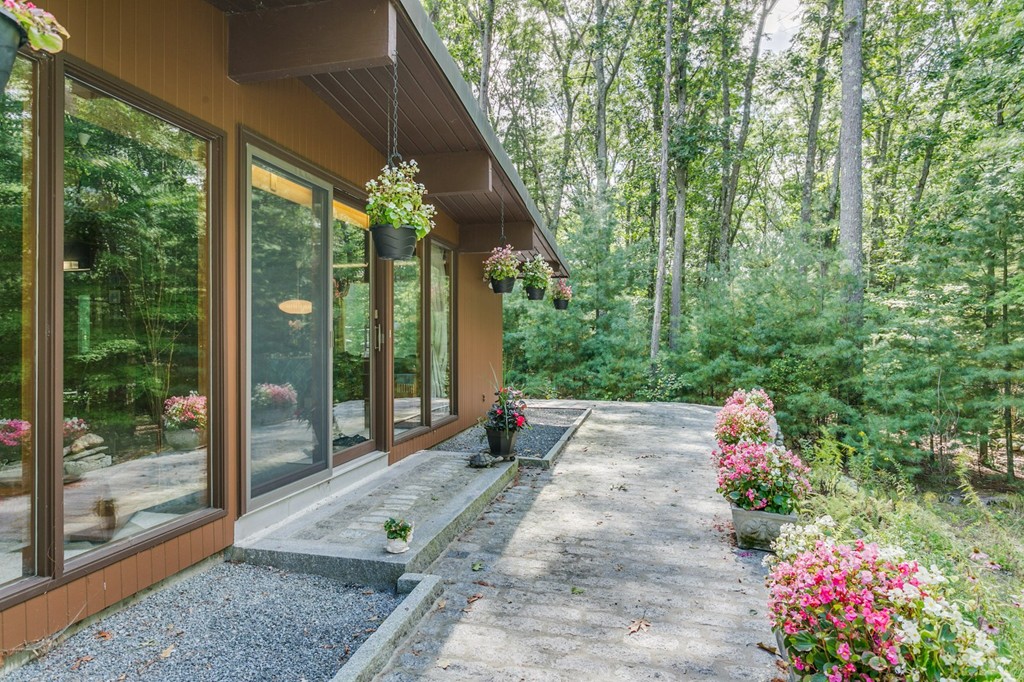 27 Conant Road Lincoln, MA 01773 - Photo 2 of 16 a garden view with a seating space