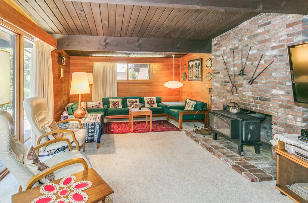 27 Conant Road Lincoln, MA 01773 - Photo 3 of 16 a living room with furniture and a fireplace
