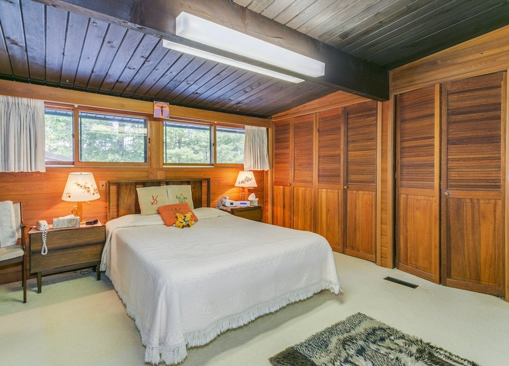 27 Conant Road Lincoln, MA 01773 - Photo 8 of 16 a bedroom with a bed and a dresser next to a window