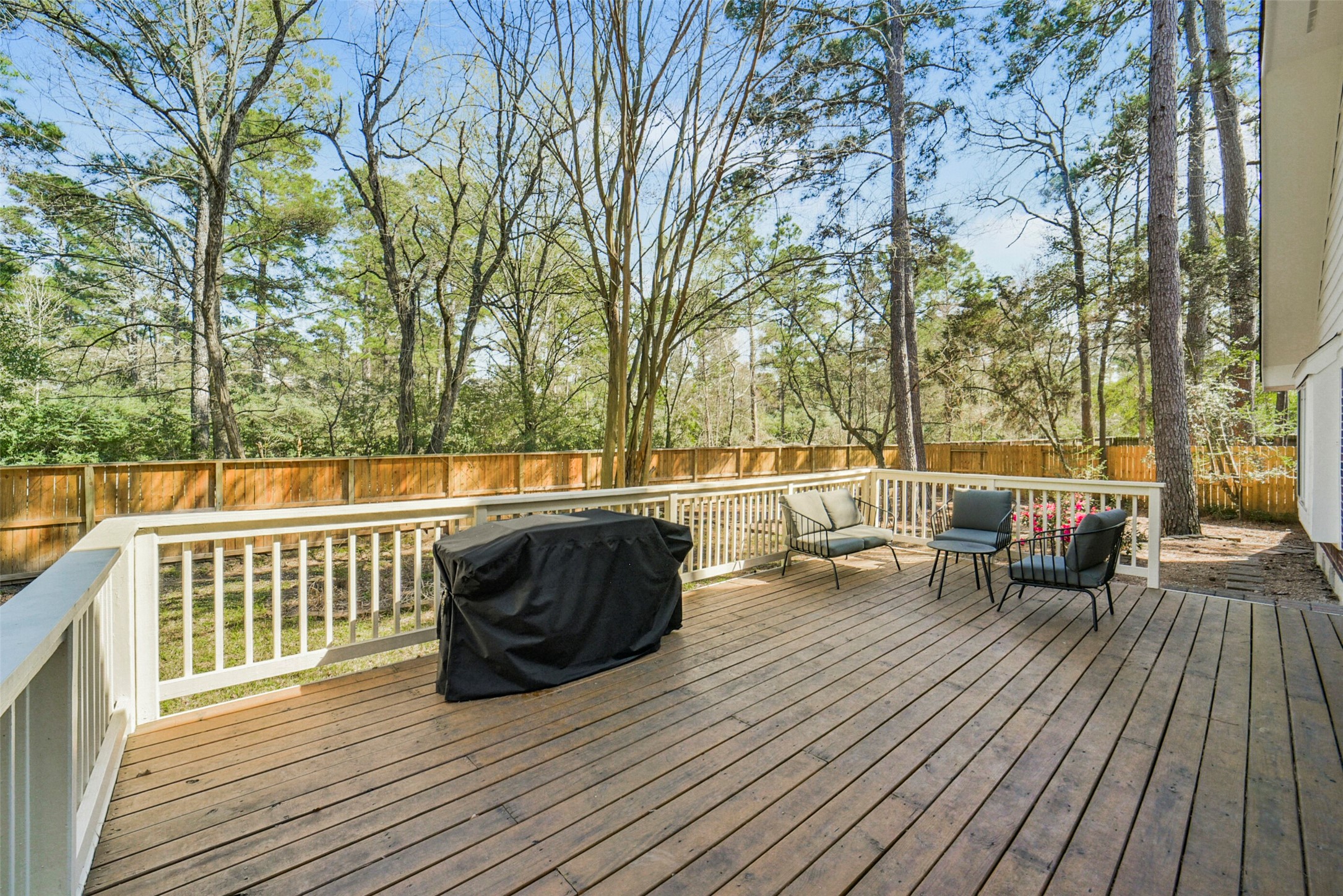 38 Tallow Hill Place Spring, TX 77382 - Photo 49 of 50 a view of a deck with chairs and wooden floor