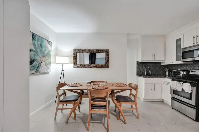 a bedroom with furniture and a flat screen tv