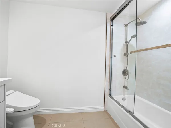 a bathroom with a bathtub and a toilet