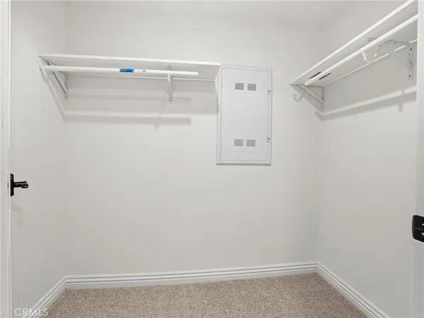 a view of an empty walk in closet