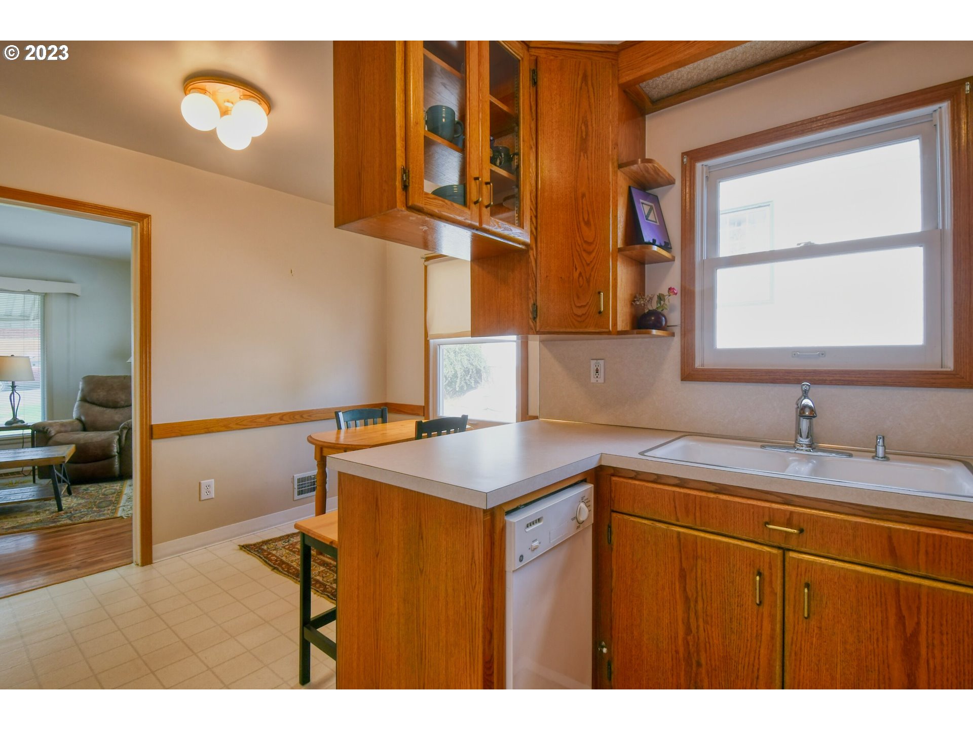 630 Northwest 9th Street Pendleton, OR 97801 - Photo 12 of 45 a kitchen with a sink cabinets and a wooden floor