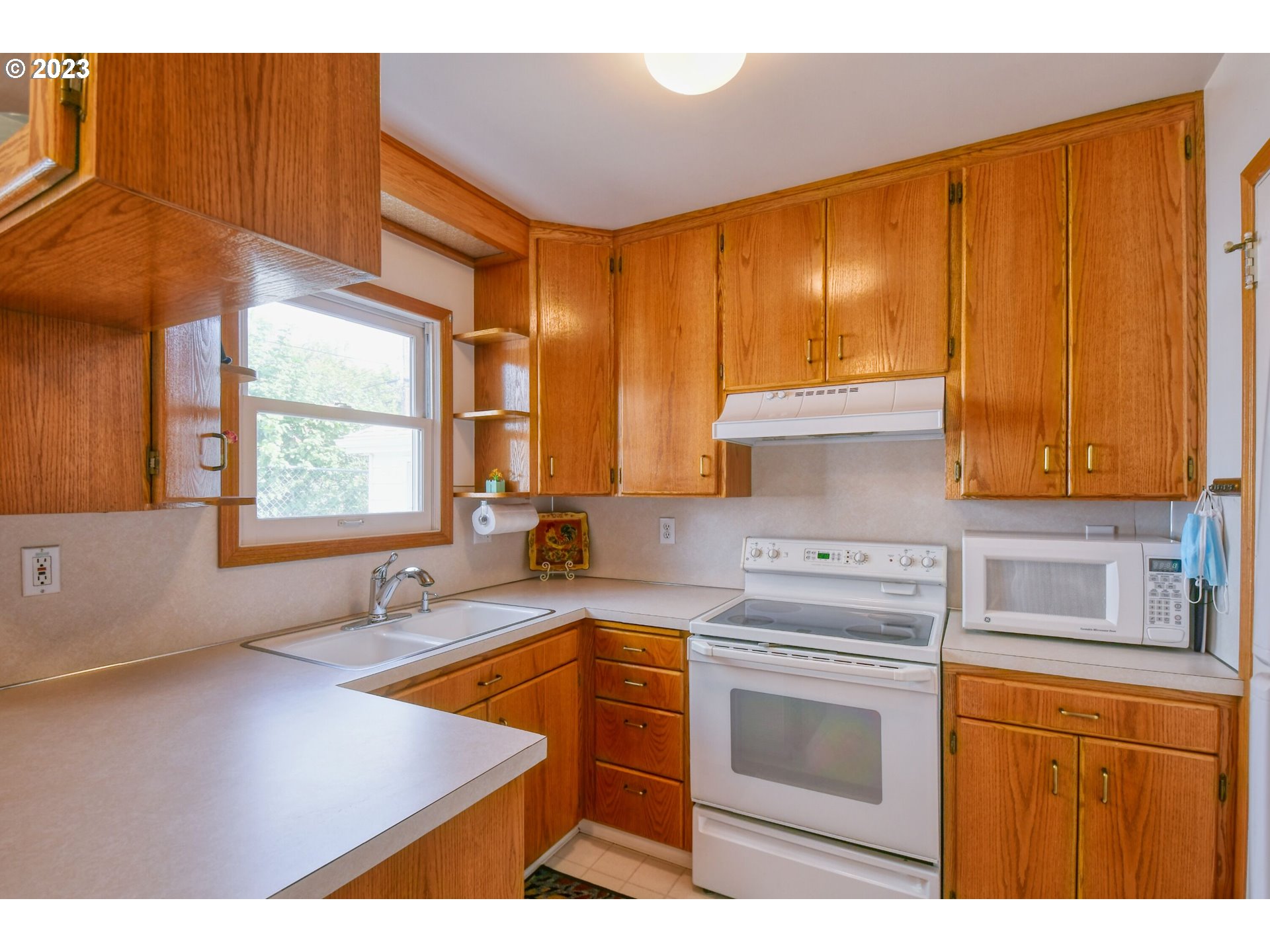 630 Northwest 9th Street Pendleton, OR 97801 - Photo 13 of 45 a kitchen with stainless steel appliances granite countertop a sink stove and cabinets