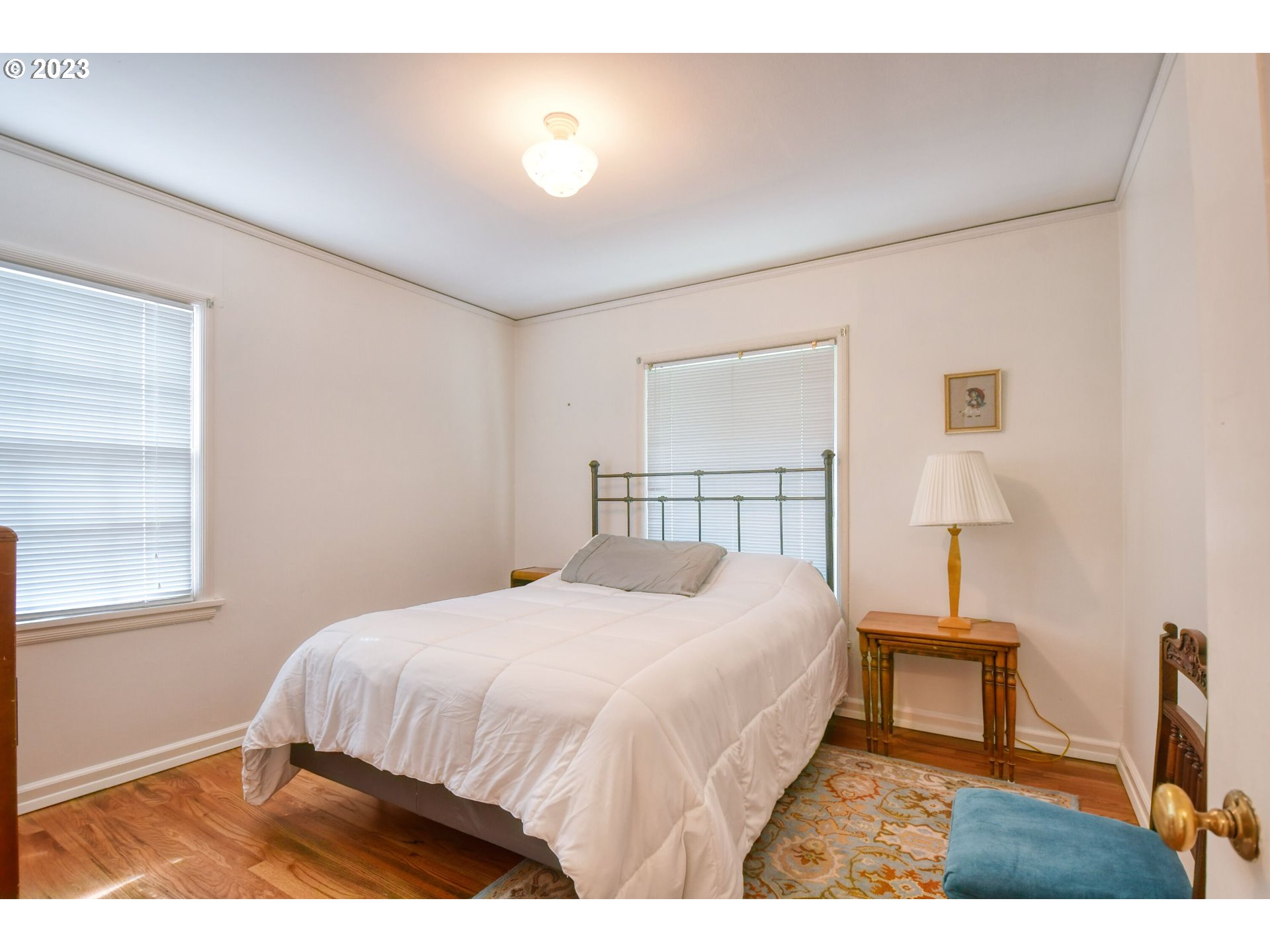 630 Northwest 9th Street Pendleton, OR 97801 - Photo 21 of 45 a bedroom with a bed and a night stand