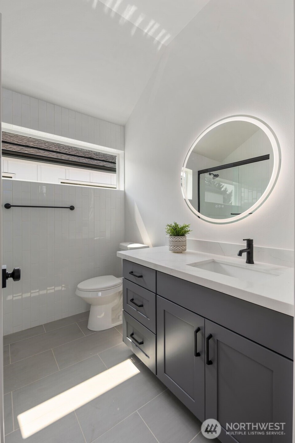 820 South Sullivan Street Seattle, WA 98108 - Photo 14 of 18 a bathroom with a toilet a sink and mirror