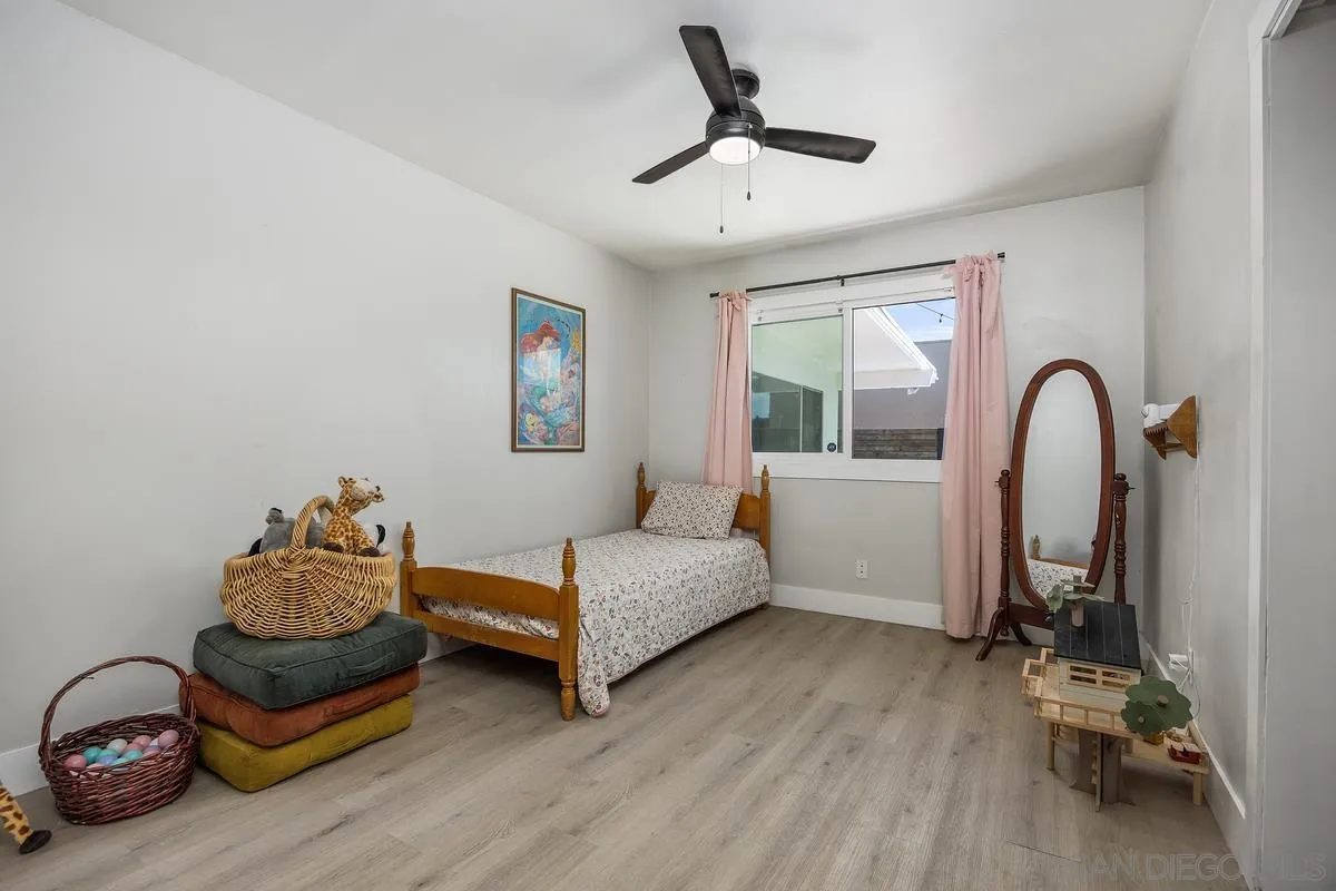 1211 East Mission Road Fallbrook, CA 92028 - Photo 20 of 31 a bedroom with furniture and a large window
