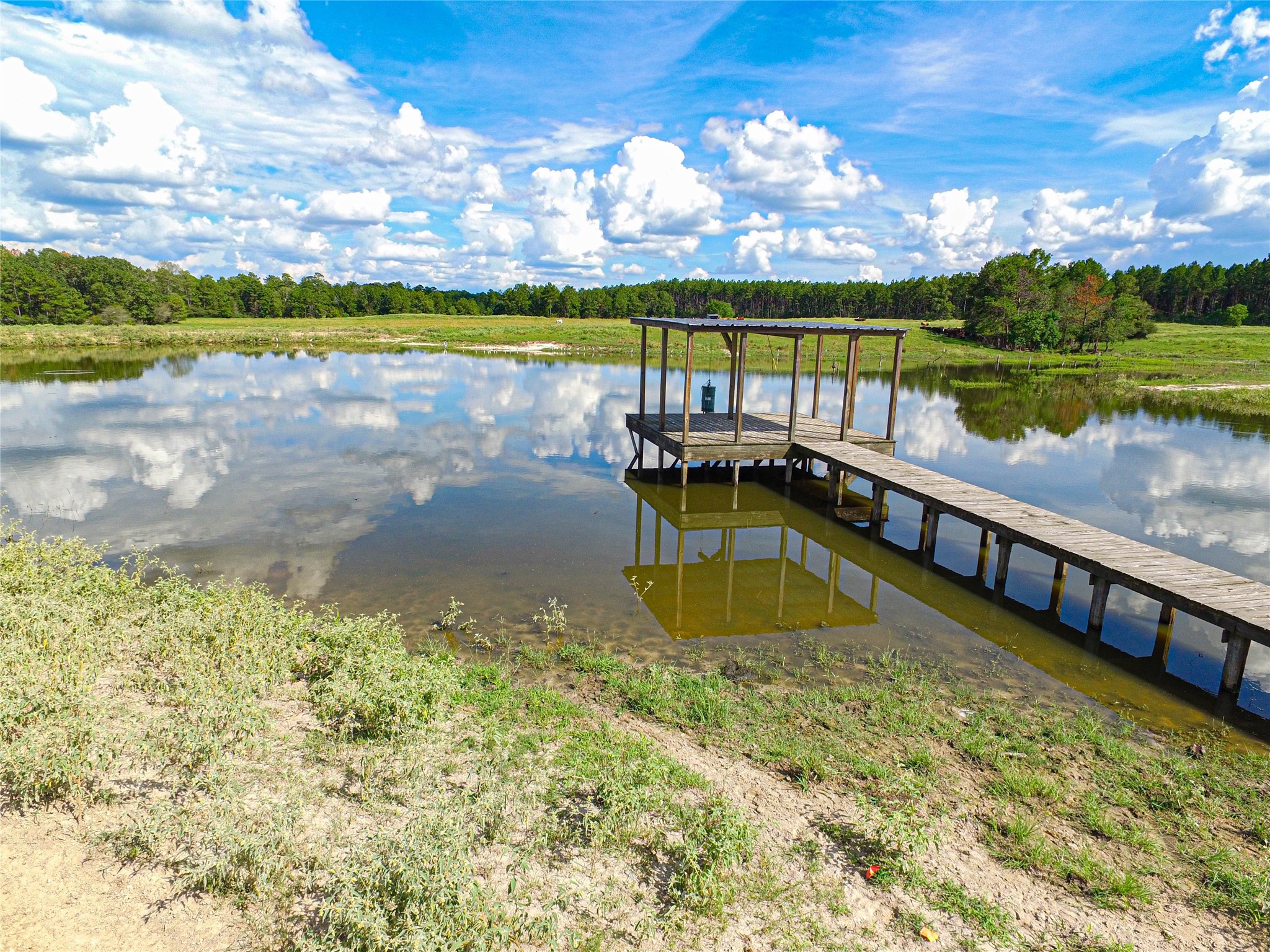 20720 Highway 59 Corrigan, TX 75939 - Photo 22 of 50 a view of a lake with a patio