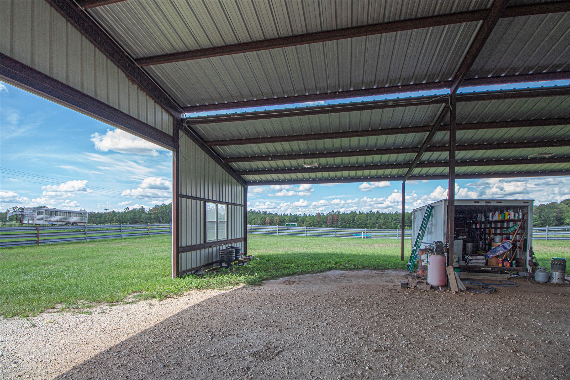 20720 Highway 59 Corrigan, TX 75939 - Photo 27 of 50 a view of a room with wooden floor and outdoor space
