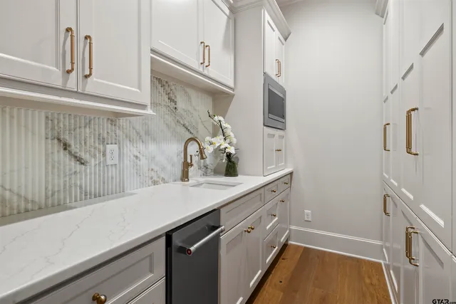 a view of a kitchen cabinets and a sink